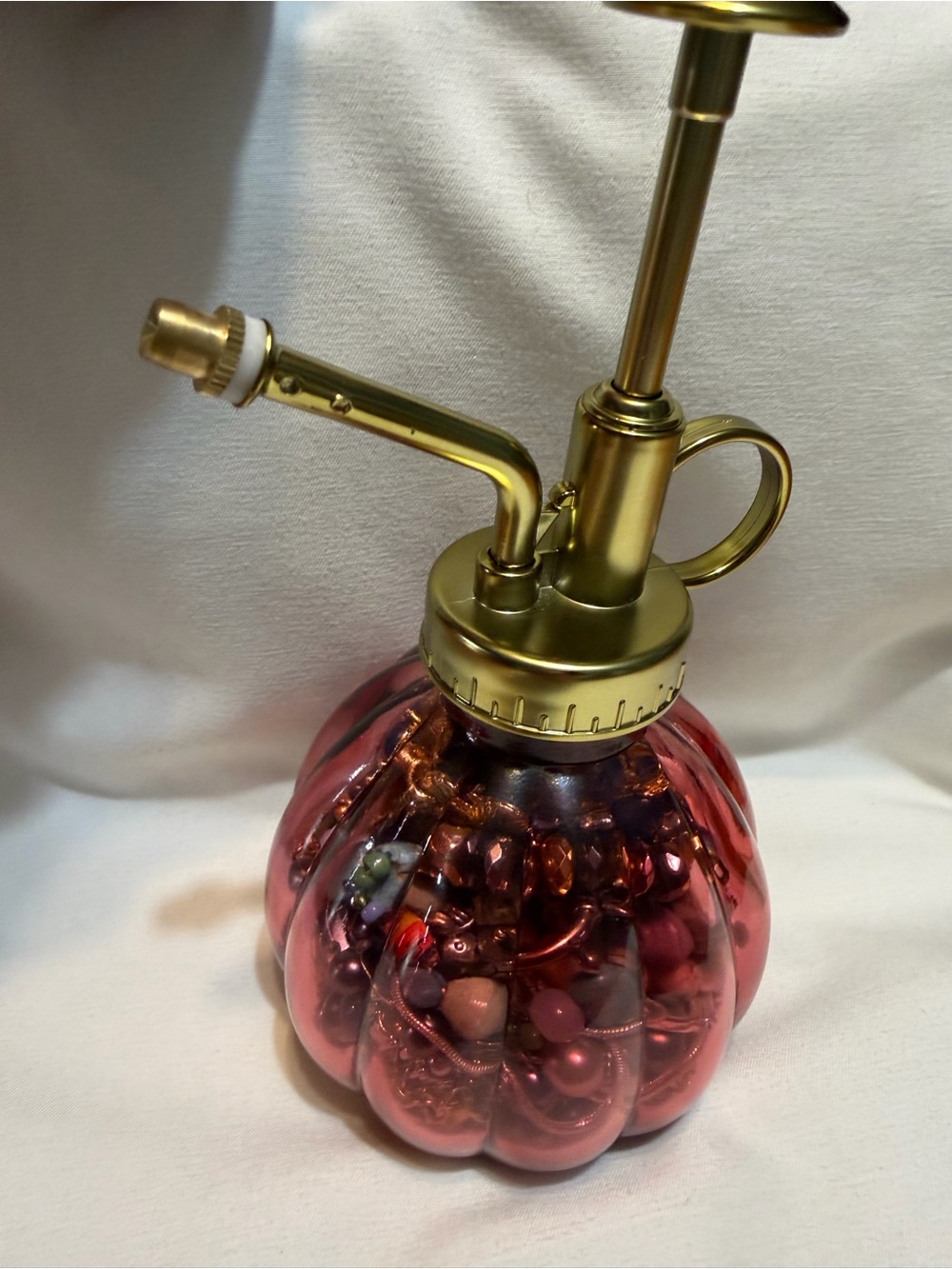 Mystery jewelry in a Decorative Pink Glass Mister with Gold-Tone Pump!!
